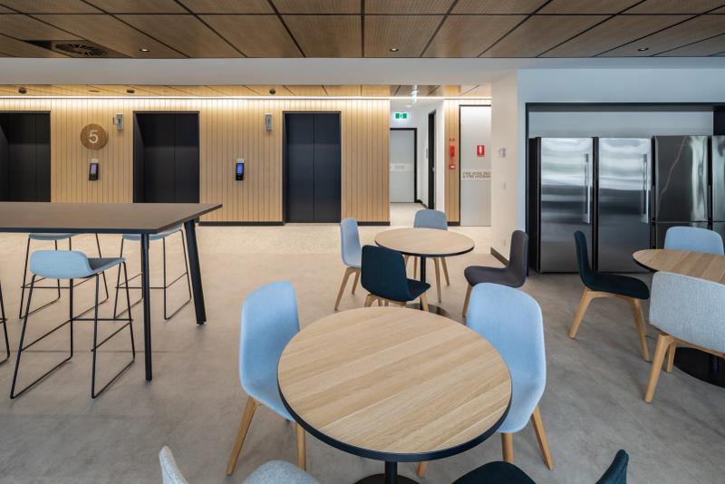 AUS Design timber acoustic wall panels and perforated timber acoustic ceiling in a commercial breakout space, by Acoustic Panels Australia