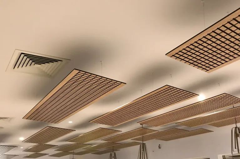 AUS Groove™ modular grooved acoustic panels suspended as ceiling rafts in a commercial fit-out, showing how the panels are arranged across a ceiling — Acoustic Panels Australia